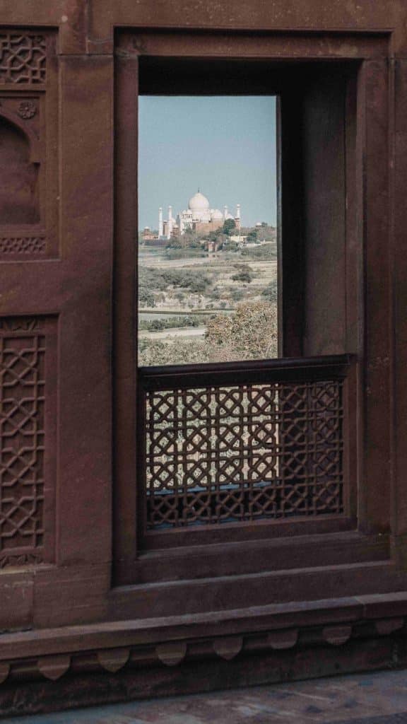 Agra fort - open window with views of a mosque