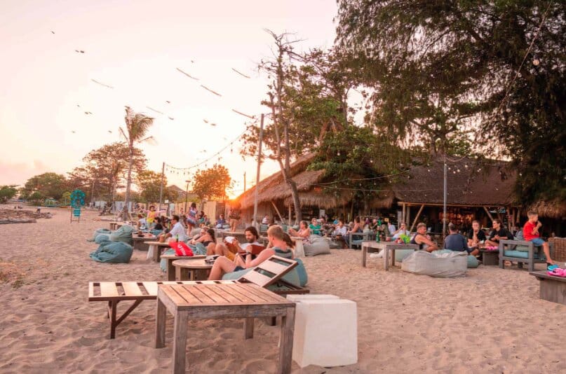 People on beach at Genius Cafe Sanur